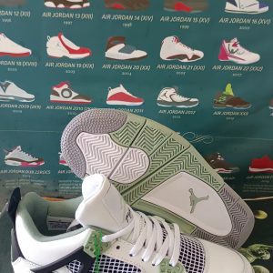 AJ4 white, black and green leather